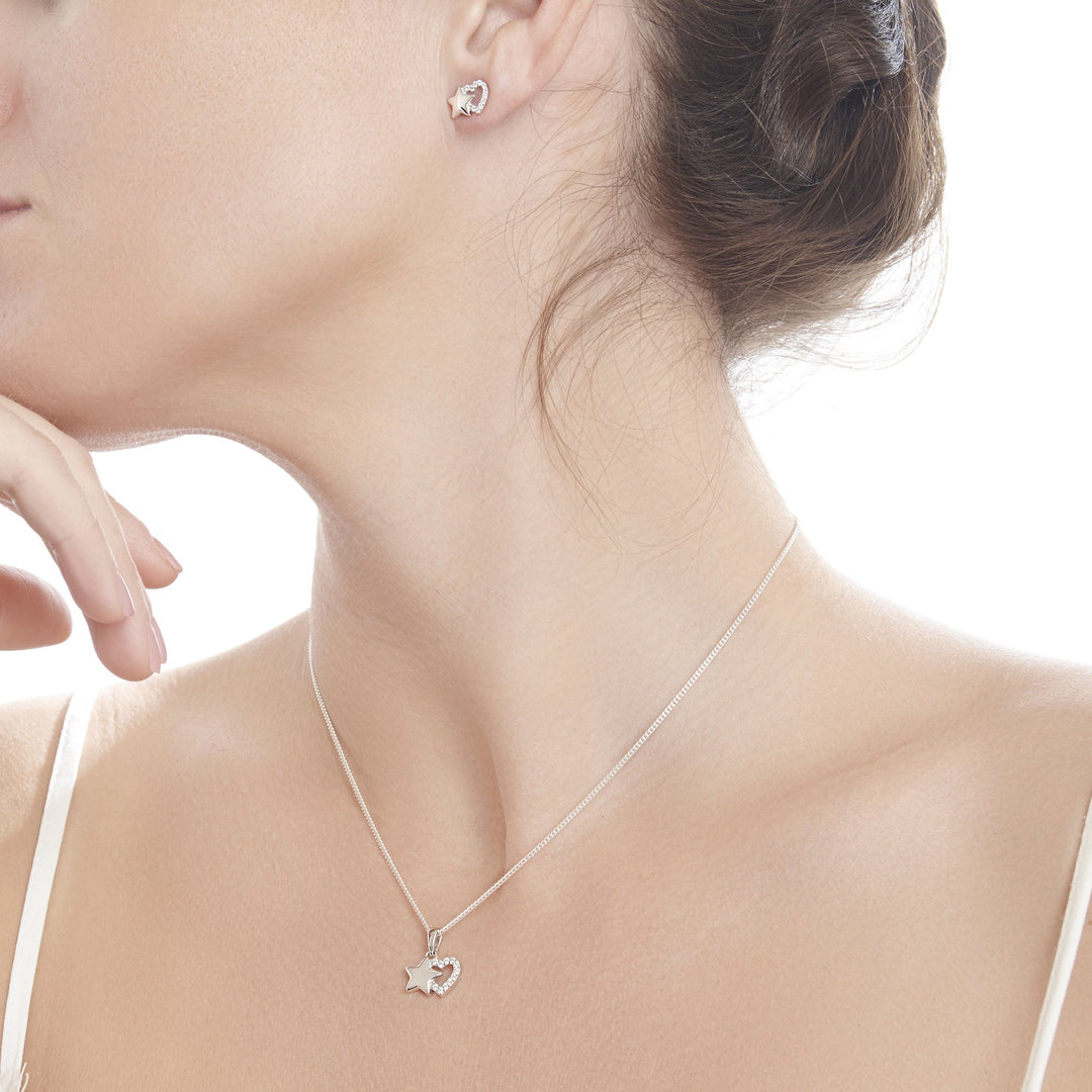 Model wearing 925 sterling silver star & cubic zirconia heart pendant (P2852S1)