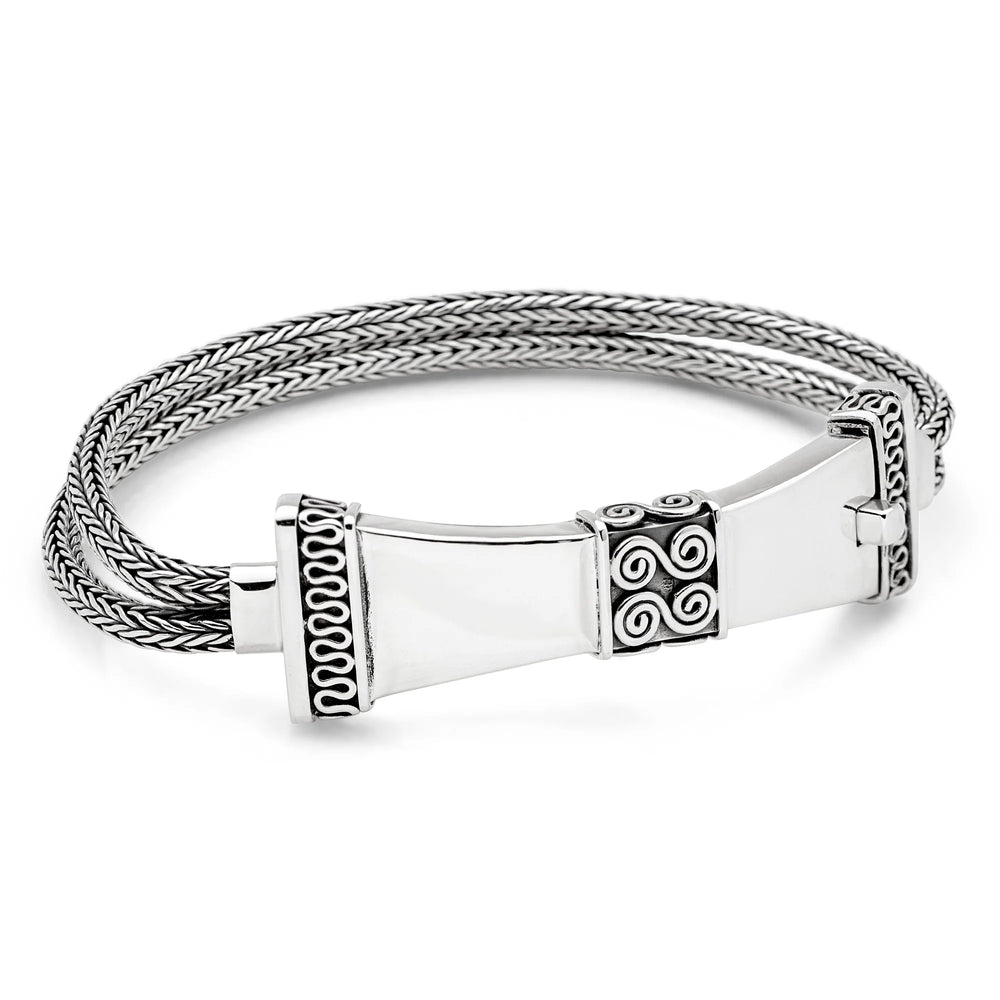 A sterling silver bracelet with a detailed Balinese wirework design and a shapely tactile clasp.