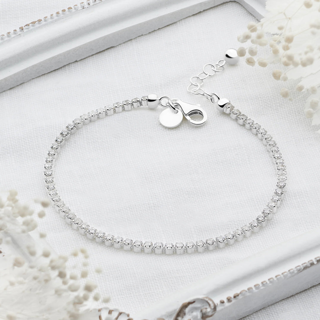 Sterling silver tennis bracelet with continuous row of sparkling cubic zirconia stones