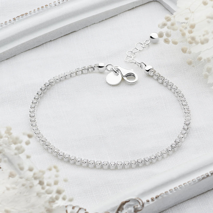 Sterling silver tennis bracelet with continuous row of sparkling cubic zirconia stones