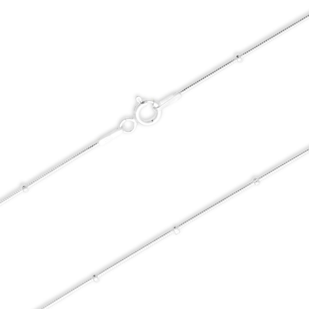 Silver chain necklace on a white background
