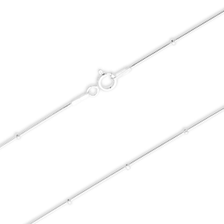 Silver chain necklace on a white background