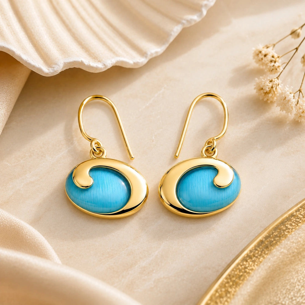 Gold with blue cat’s eye gorgeous earrings. 