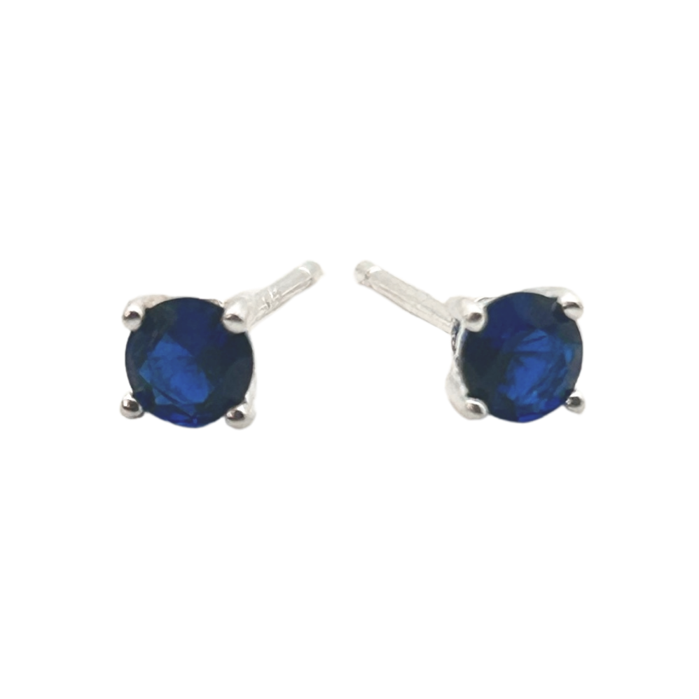 Pair of blue gemstone stud earrings on a white background