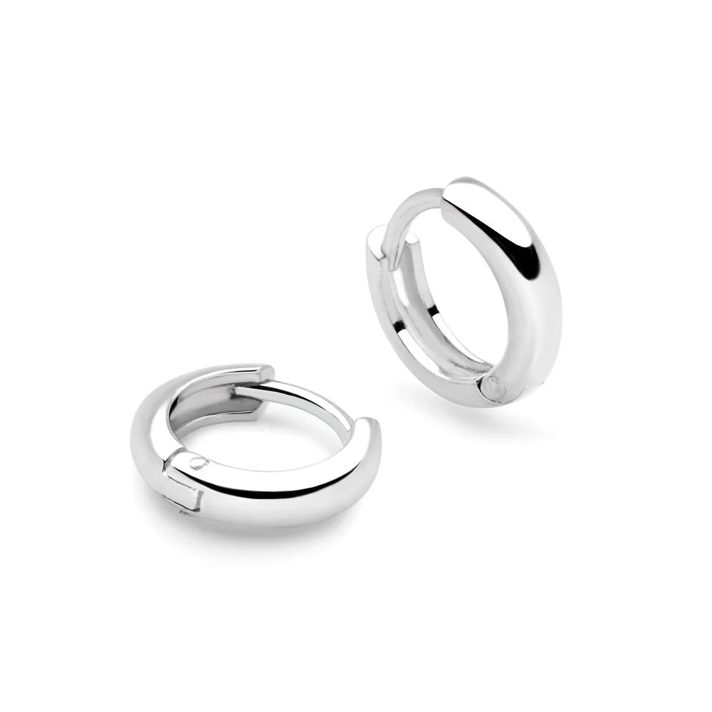 A pair of silver hoop earrings with a hinge fastening, displayed against a white background.