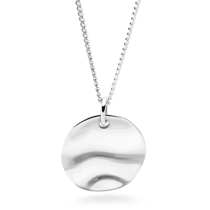 Silver necklace with a round pendant on a white background