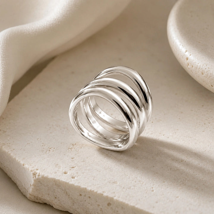 A stylish 925 sterling silver band with a twisted design which wraps around the ring.