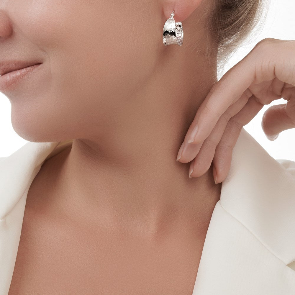 A stylish concave hoop that feature an extra wide body with a beautifully hammered surface. These hoops make a statement and effortlessly take your style from day to night.