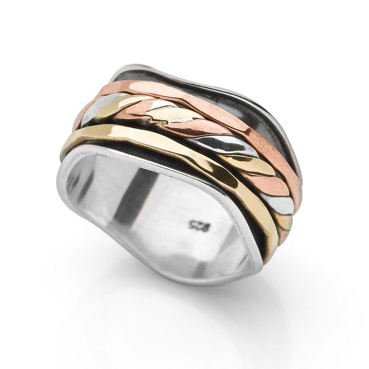 A wavy 925 sterling silver band, wrapped with bands of twisted silver, brass and copper which move freely spin ring