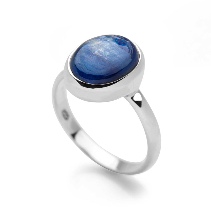 A ring with a central blue kyanite cabochon, set in a high polish finish 925 sterling silver band.
