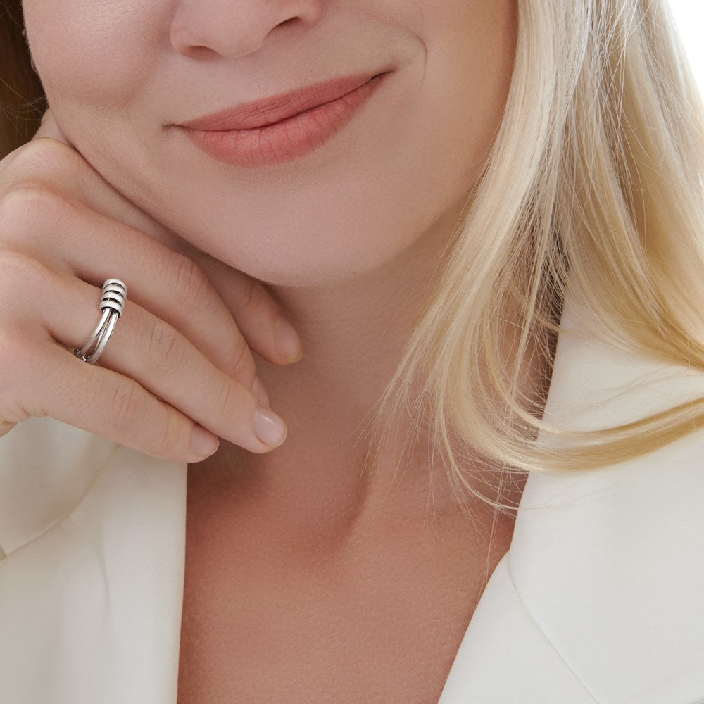A polished 925 sterling silver ring with a unique design featuring three tethered rings and four sleek silver coils.