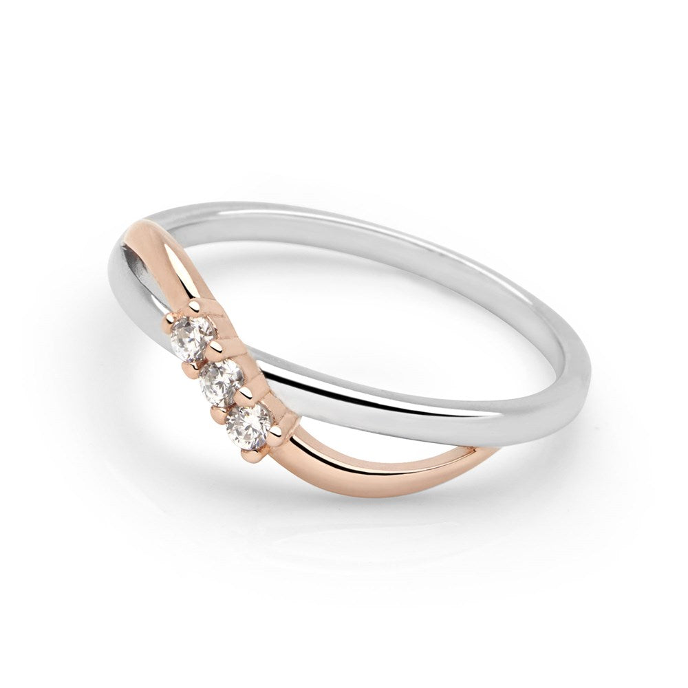 A sleek silver eternity style ring with a rose gold bridge and sparkling cubic zirconia stones white background. 